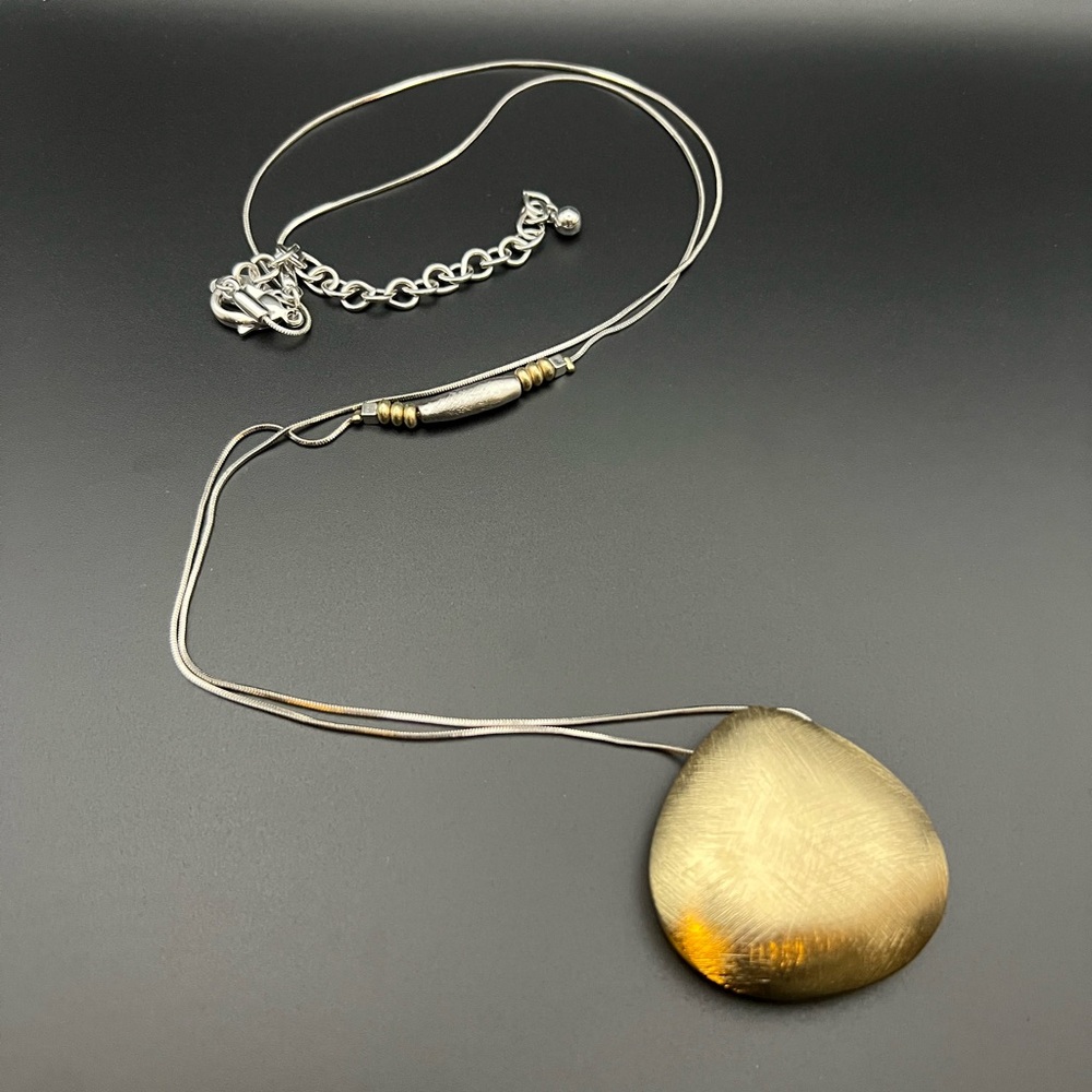 Chicos Long Strand Silver and Gold Tone Necklace with Clam Shell Shaped Pendant